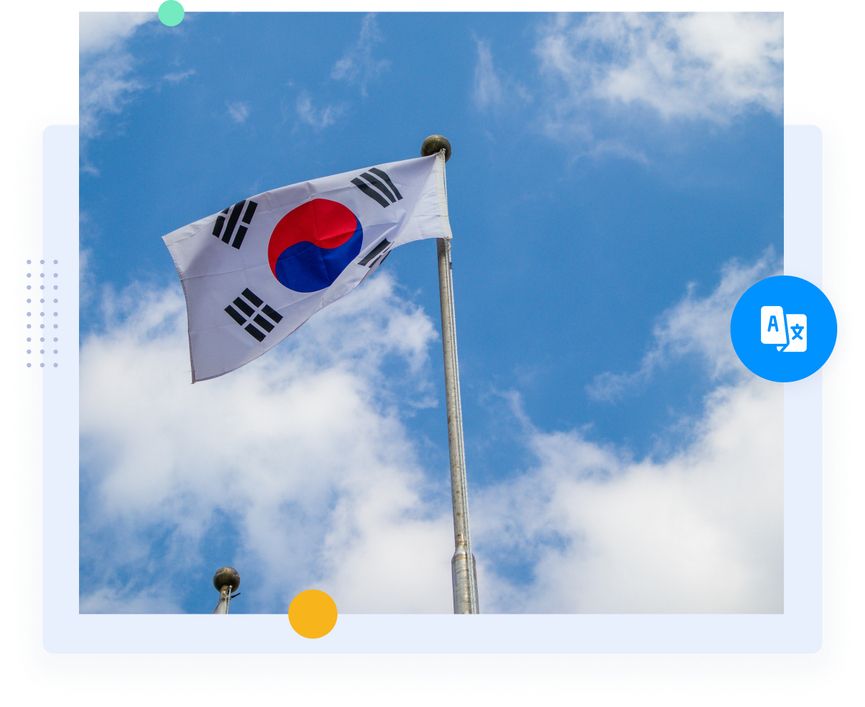 South Korean flag on a flag pole flying with the sky in the background.