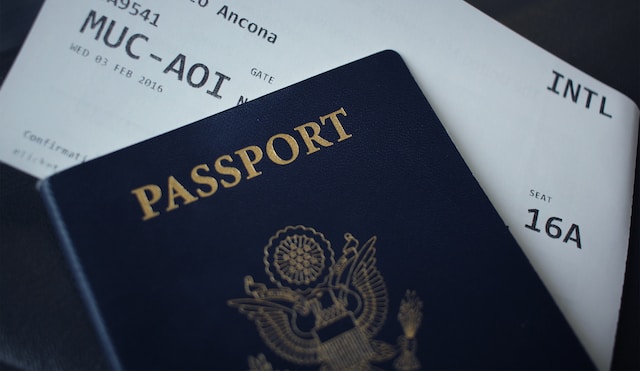 A picture of a passport booklet on another open booklet.
