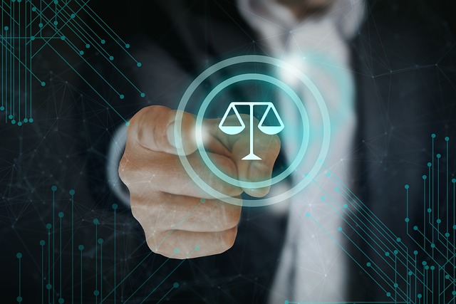 A person points to a scale of justice.