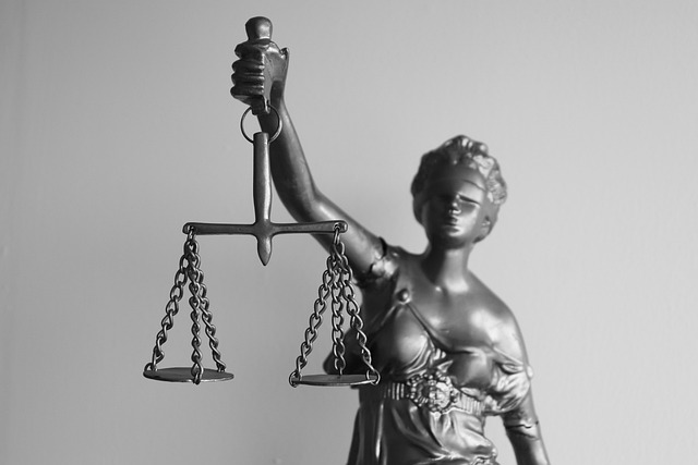 A statue of Lady Justice holding a balance scale.
