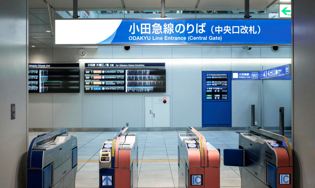 Japanese subway with signs written in Japanese and English.